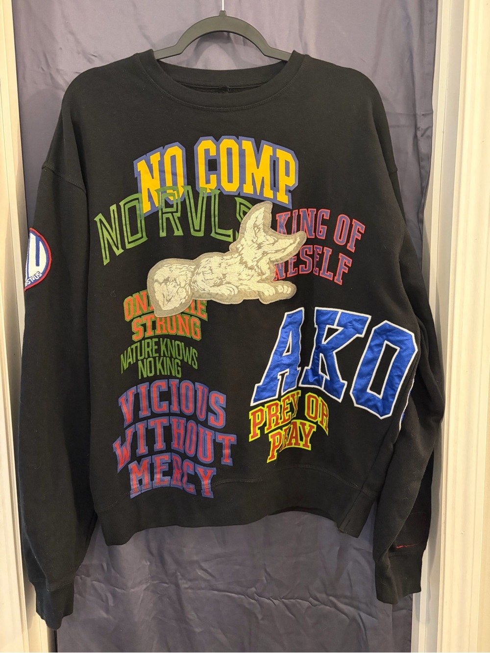 Akoo sweatshirt features various embroidered streetwear patches slogan graphics.